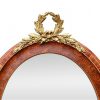 antique-oval-mirror-pediment-in-gilded-bronze-with-a-bow-of-leaves